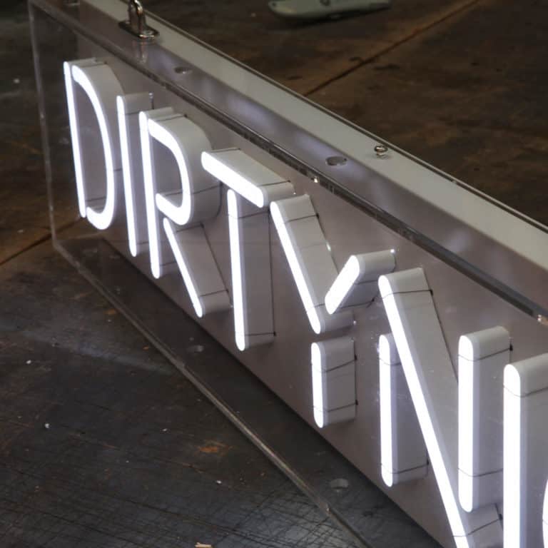 A close up of 'Dirty' NeonPlus slim lettering