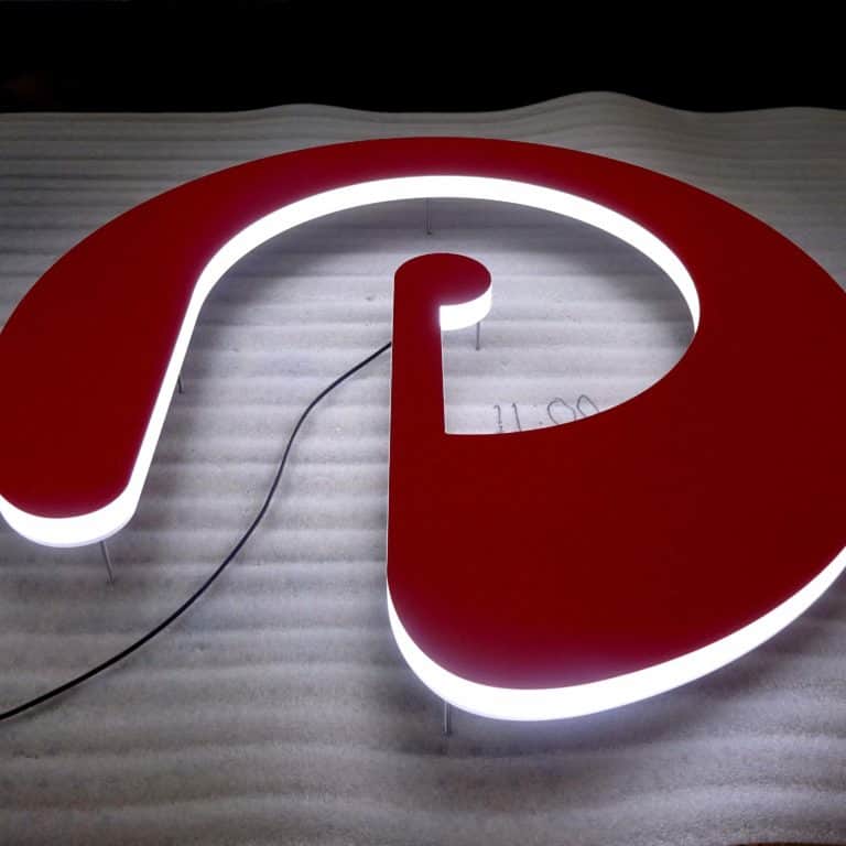 Lower case e with p cut out branding logo with red face and white edges, illuminated with LEDs for store front sign