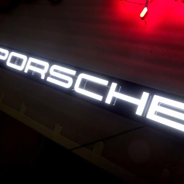White Neon Porsche Sign using Faux Neon LEDs for retail & showroom signs.