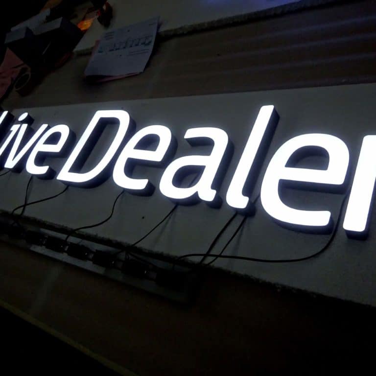 Box illuminated neon signs for venues and casinos. Live Dealer faux neon writing in white.