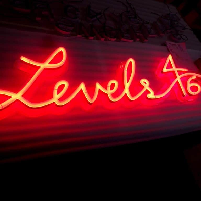 Red Neon Sign in cursive handwriting. Levels 4/16 fake digital neon sign from Neonplus