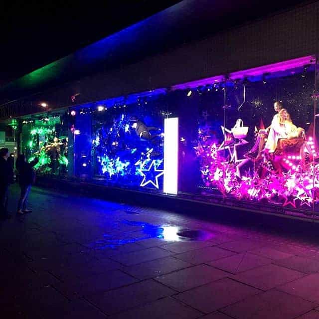 Coloured LED neon stars in Debenhams Oxford Street Christmas window display