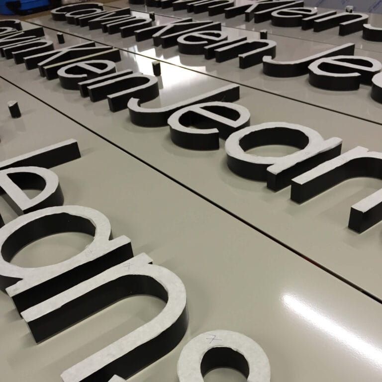 Row of Neonplus® Calvin Klein tray signs